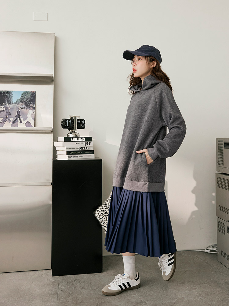 Hoodie tucked into a pleated midi skirt